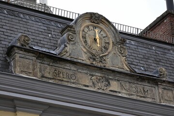 Antique clock on top of a stone structure