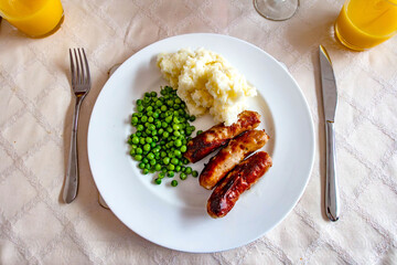 Sausages, mashed potatoes and garden peas for dinner.