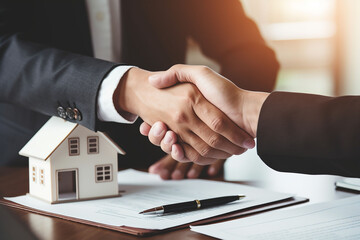 	
Real estate agent shaking hands with customer after signing contract to buy or sell house - obrazy, fototapety, plakaty