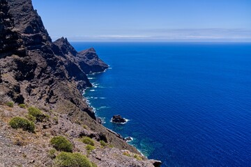 Scenic view of a rocky beach against sea waves