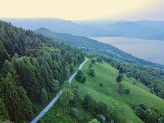 Winding scenic road that meanders through a picturesque landscape of lush green hills