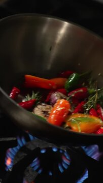 Toss the vegetables in the pan while frying