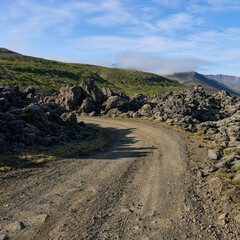 A view of the dirt road among the lava fields. Helgafellssveit, Iceland.