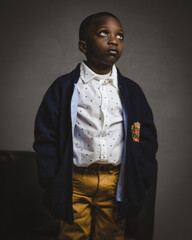 Handsome young african boy posing in front of. camera