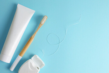 Oral hygiene products on a colored background with space for text 