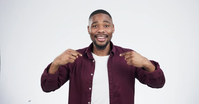 Talking, pointing and face of a black man on a white background for choice, hiring or decision. Happy, excited and portrait of an African person with a gesture for recruitment isolated on a backdrop