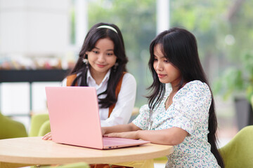 Beautiful young girls with laptop