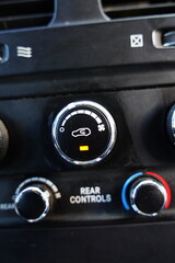 Fototapeta premium The air recirculation button effectively cuts off the outside air to the inside of the car 'recirculating' air inside your vehicle.