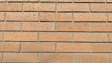 Brown brick wall taken from a straight line