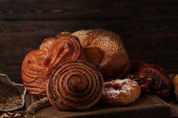 Different tasty freshly baked pastries on table