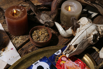 Witch's magic attributes on wooden table, closeup