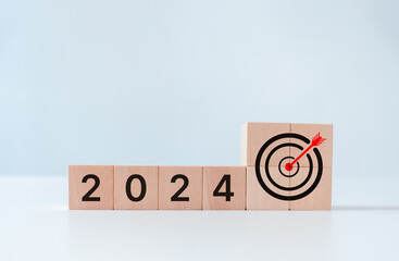 2024 goals of business target achievement or life. Wooden cubes block with 2024 and goal icon on...