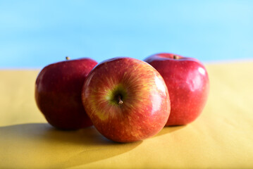 natural and healthy tropical fruit apples on the table on white texture background