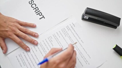 Young caucasian man screenwriter writing script at office