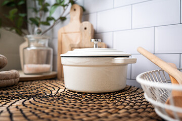 Kitchen counter top with utensil and duct oven pot or cast iron pot. cooking food concept.