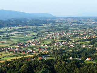 Obraz premium View of forests, fields, villages and Zagorje hills, during a panoramic balloon flight over Croatian Zagorje - Croatia (Panoramski let balonom iznad Hrvatskog zagorja - Hrvatska)