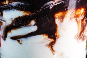 Chilled Delight: Side View of Ice Cream with Melting Chocolate