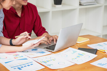 Marketing, Financial, Accounting, Planning, Team of business women analyze company results and profits with graph statistics. Use a laptop computer and a calculator to calculate the company balance.