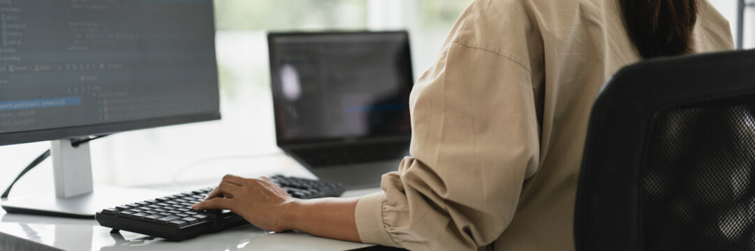 Developer programmer programming code to developing website and application in software office