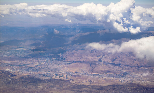 mountains and valley at san gorgonio pass riverside county, with clouds over the san jacinto area, san bernardino mountains, highland springs, cherry valley, banning, beaumont, interstate 10