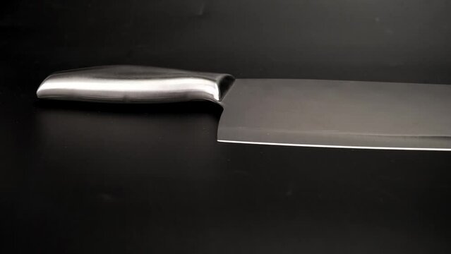 Kitchen knife. Large sharp knife with stainless steel handle isolated on white background.