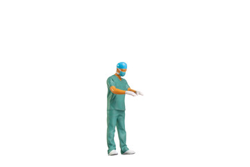 Miniature people young doctor in scrubs Isolated on white background with clipping path