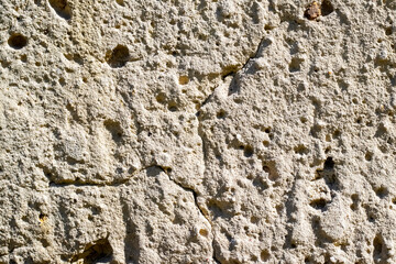 Sandstone stone texture with grain and irregularities in bright sunlight