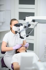 professional dentist examination patient with microscope at the office