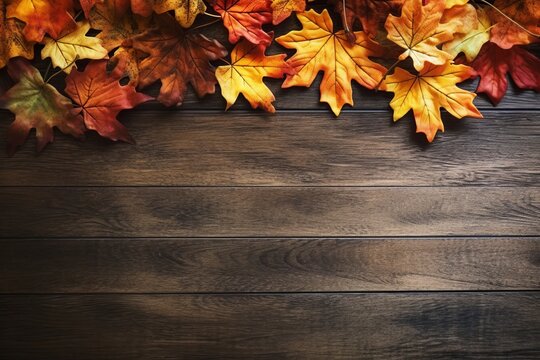 Thanksgiving background maple fallen leaves on a natural wooden table. banner with copy space for text. Halloween, or seasonal design mock up template