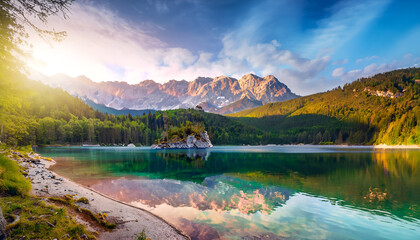 Impressive summer sunrise on Eibsee Lake with Zugspitze mountain range. The sunny outdoor scene in German Alps, Bavaria, Germany, Europe. The beauty of nature concept background.