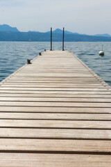 Naklejka premium Wooden pier overlooking the Alps and Lake Geneva in Switzerland
