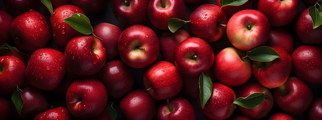 Fotobehang Red apples with leaves, closeup with top view, Red apple patterns, Top view of bright ripe fragrant red apples with water drops as background © ImaginaryInspiration