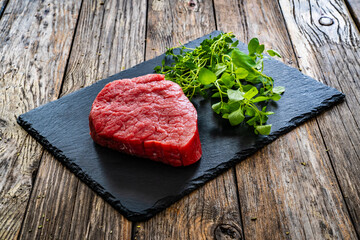 Fresh raw beef meat on cutting board
 - obrazy, fototapety, plakaty