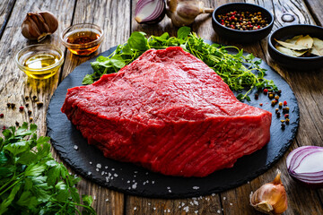 Fresh raw beef meat on cutting board
 - obrazy, fototapety, plakaty