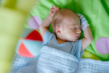 Newborn baby dreaming on the bed