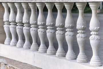 White marble balustrade in the park  . Balustrade pillars in a row 