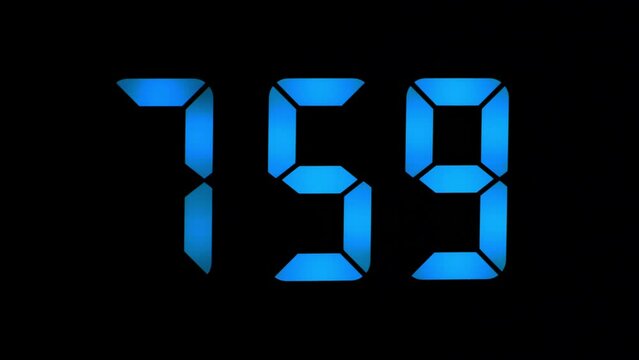 Blue LED clock close-up, shows 8-00 am, the concept of the beginning of the working day, seven-segment numbers