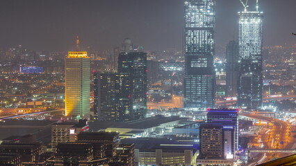 Aerial view of skyscrapers with World Trade center in Dubai day to night timelapse.