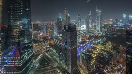 Panorama showing futuristic skyscrapers in financial district business center in Dubai night...
