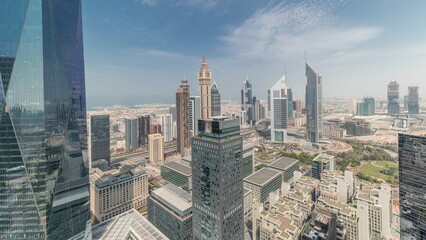 Obraz premium Panorama showing futuristic skyscrapers in financial district business center in Dubai on Sheikh Zayed road timelapse