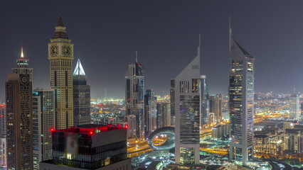 Skyscrapers on Sheikh Zayed Road and DIFC all night timelapse in Dubai, UAE.