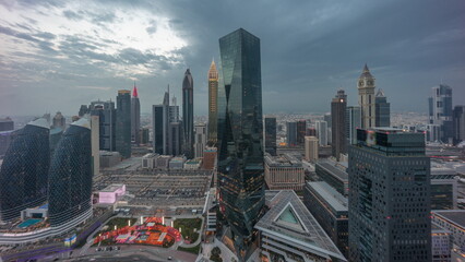 Fototapeta na wymiar Panorama of futuristic skyscrapers with sunset in financial district business center in Dubai on Sheikh Zayed road timelapse