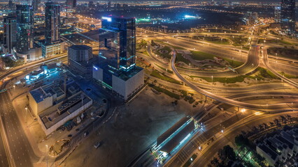 Aerial panoramic view of media city district and highway junction all night timelapse