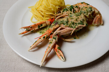 Scampi Buzara or Skampi na Buzaru King Prawns with Linguine, Garlic, Parsley and White Wine Sauce, a Typical Croatian Dish