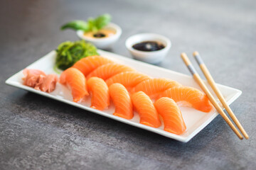 Fresh Sushi Roll with salmon.Japanese food. Copyspace black background.