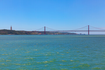 The 25th of April Bridge in Lisbon, Portugal .  View of Tagus river in Lisbon 