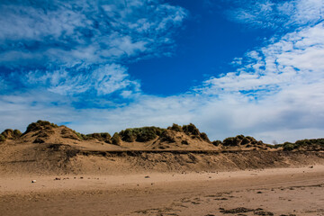 The view of the Formby Beach (Victoria Road Beach) or Formby Dunes in Liverpool, UK at sunny day. City in Merseyside county of North West England. Including the famous sand dunes. Nature, travel scene