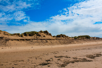 The view of the Formby Beach (Victoria Road Beach) or Formby Dunes in Liverpool, UK at sunny day. City in Merseyside county of North West England. Including the famous sand dunes. Nature, travel scene