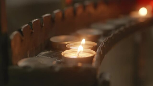 Candles burning in a christian church closeup