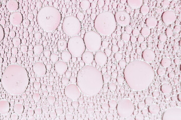 Arrière plan abstrait bulles - Huile dans de l'eau sur un fond flou multicolore	